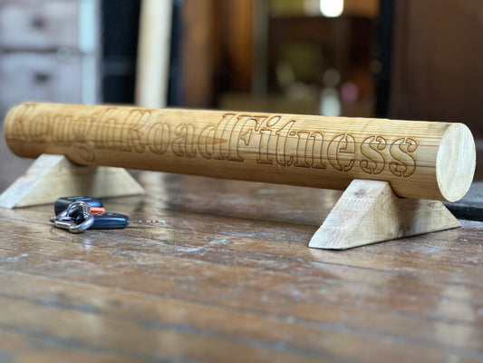 Hand-routed 3-inch thick wooden parallette, with Rough Road Fitness lasered into the side and car keys for scale, for grip strength training by Rough Road Fitness.